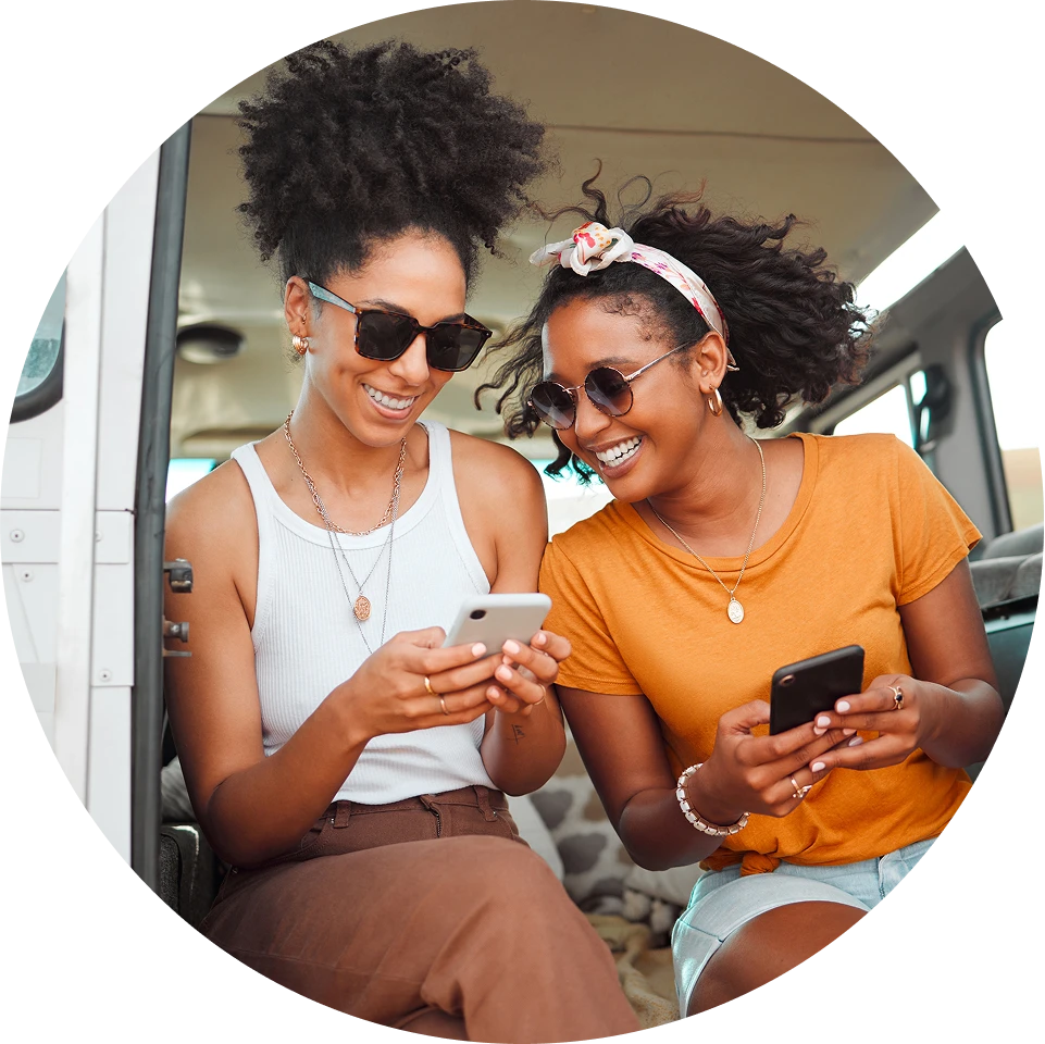 Women searching for jobs on cell phone