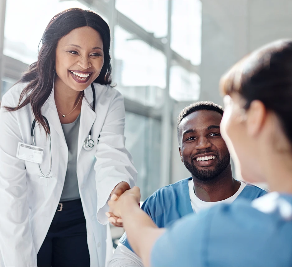 Doctor shacking hands with nurse