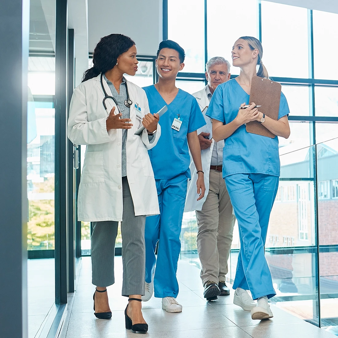 Doctor walking with nurses