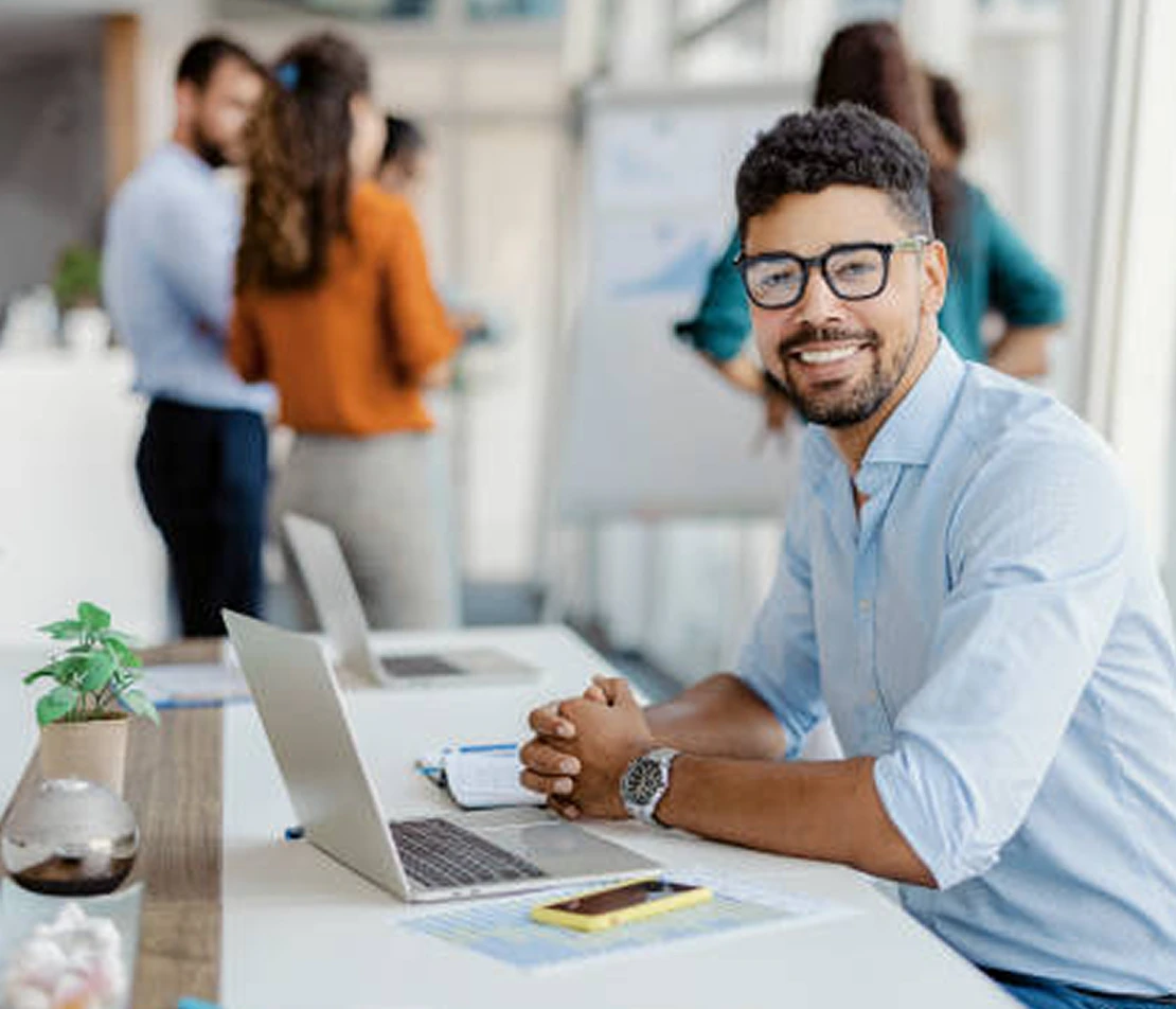 Man in office folded hands