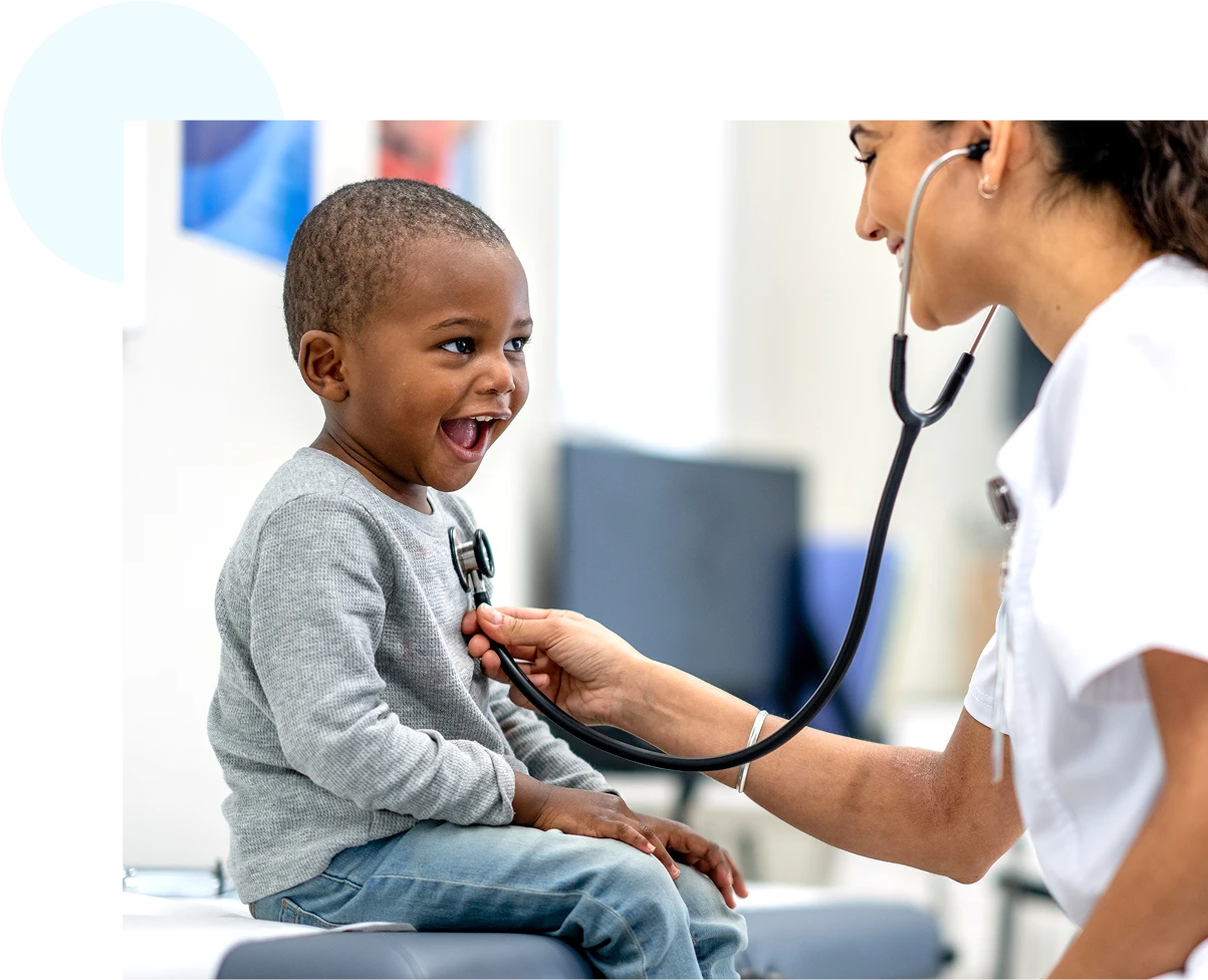 Nurse checking boys heartrate