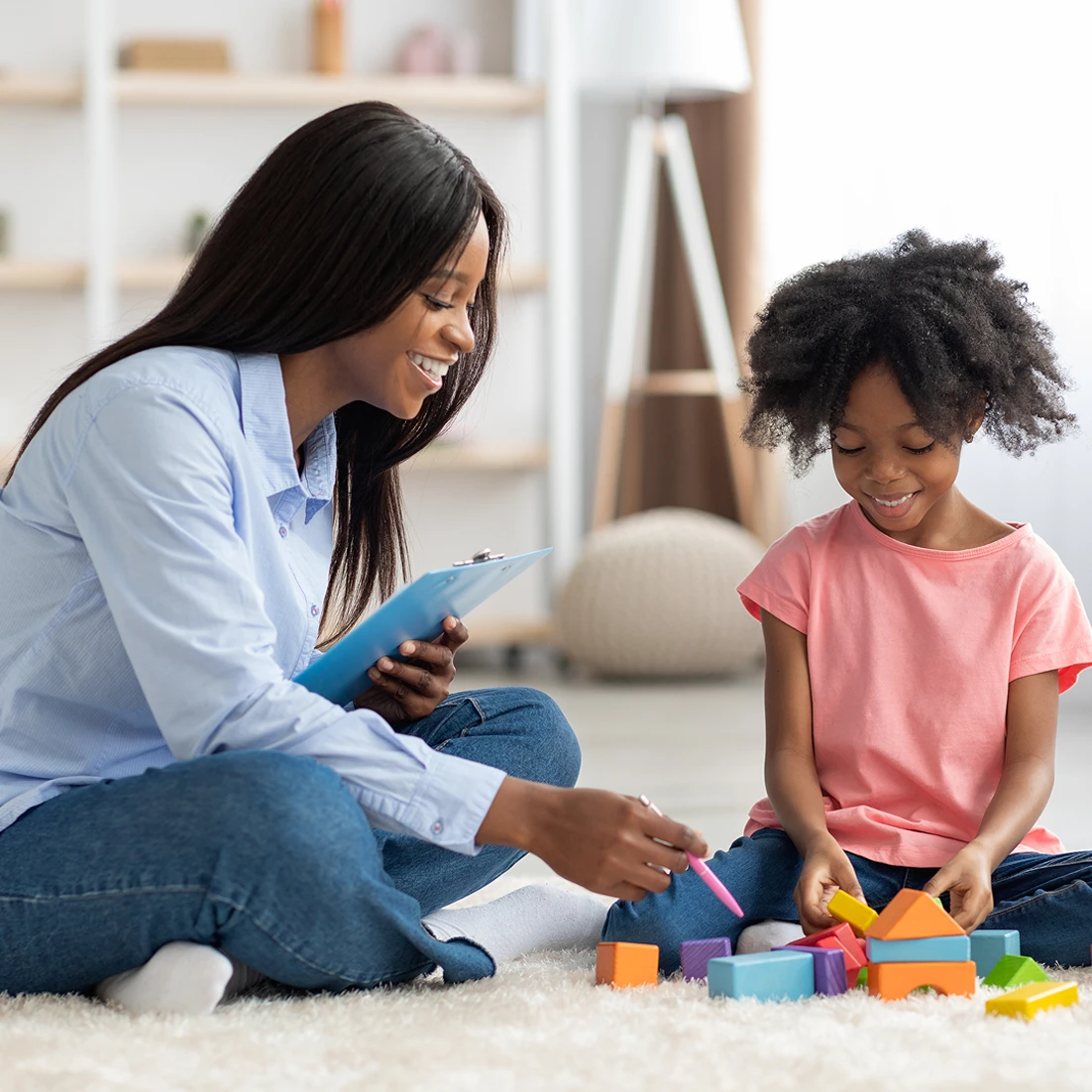 Woman and girl learning with blocks